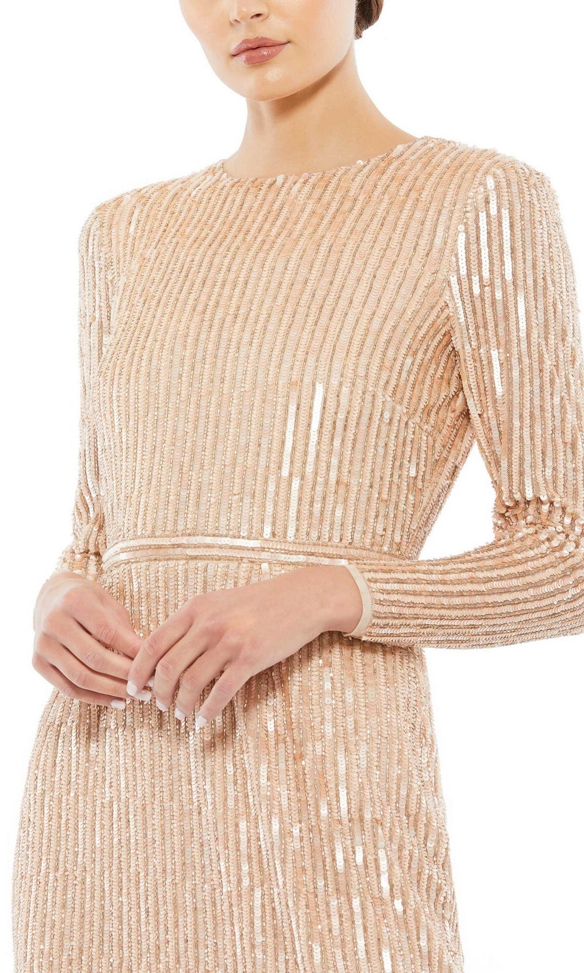A person models the Short Wedding Guest Dress 93625 by Mac Duggal—a fitted long sleeve nude mini dress with vertical striped sequin embellishments, shown from neck to mid-thigh.